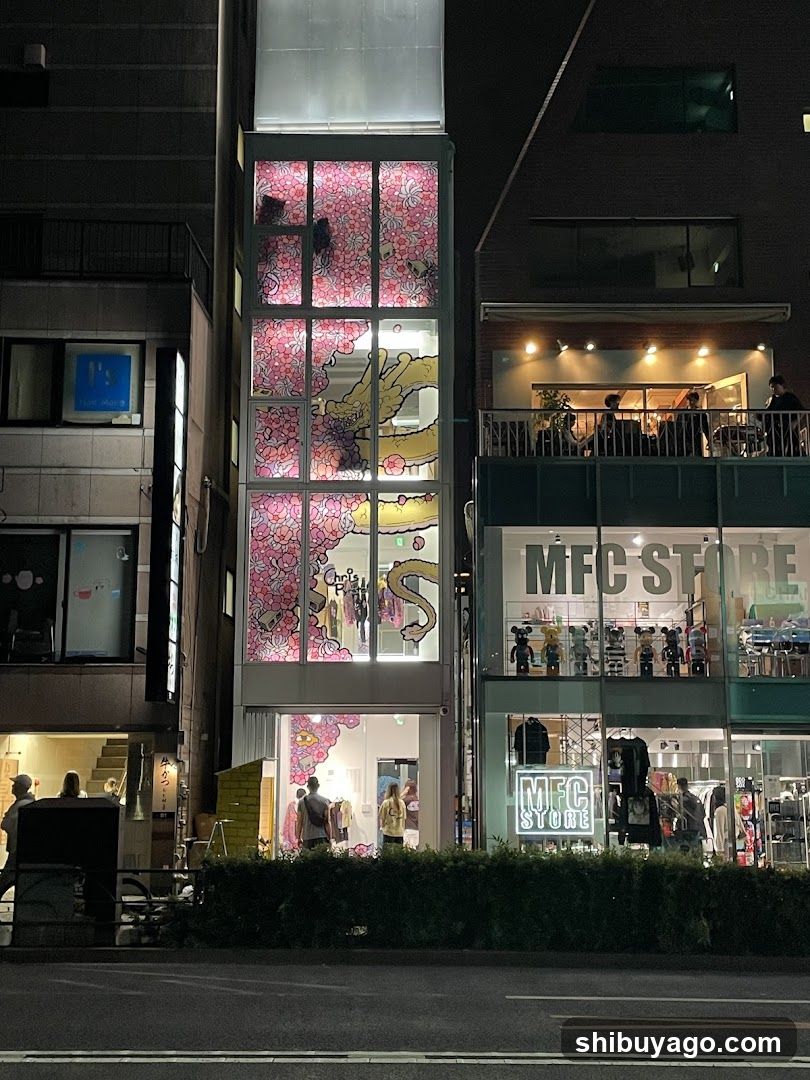 Night street scene with illuminated storefronts