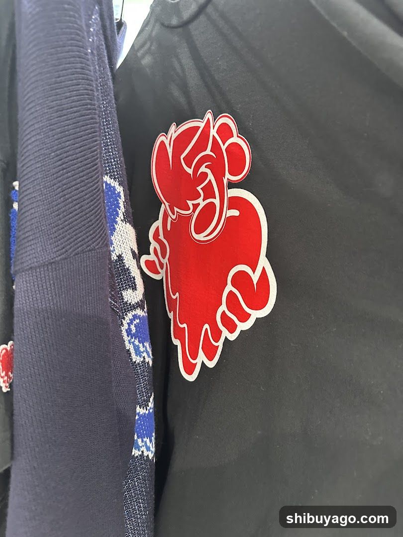Red Character Logo on Black Fabric