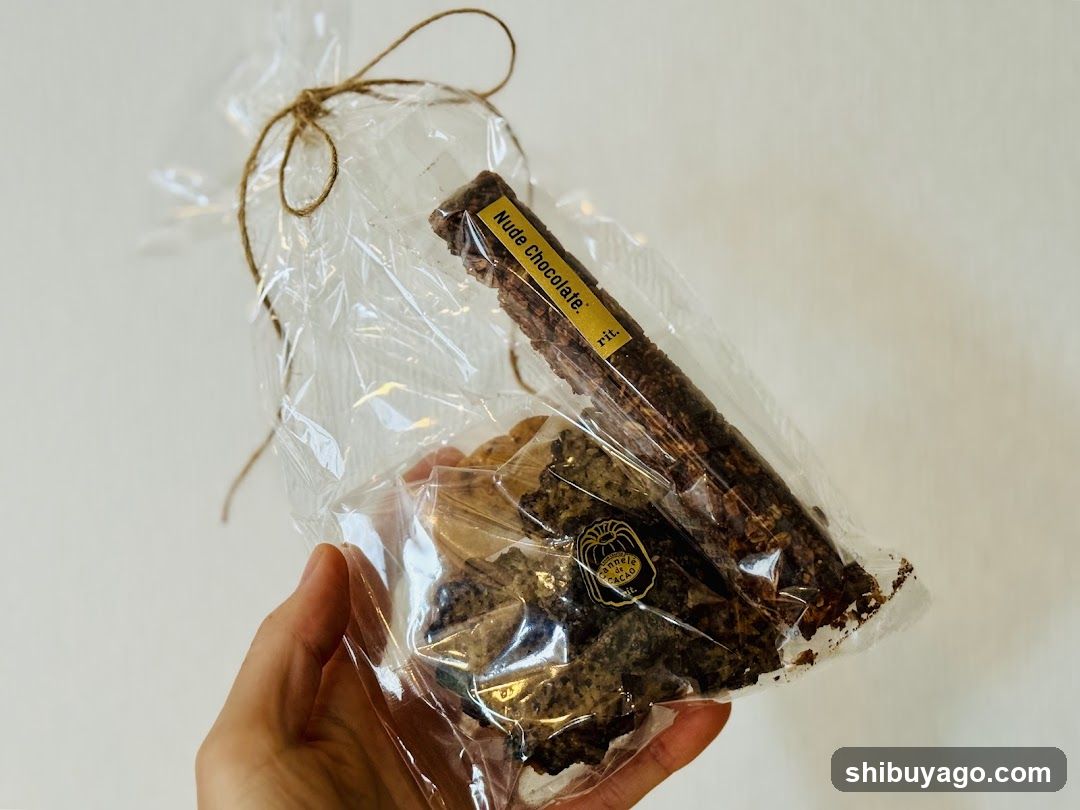 Hand holding packaged chocolate bar