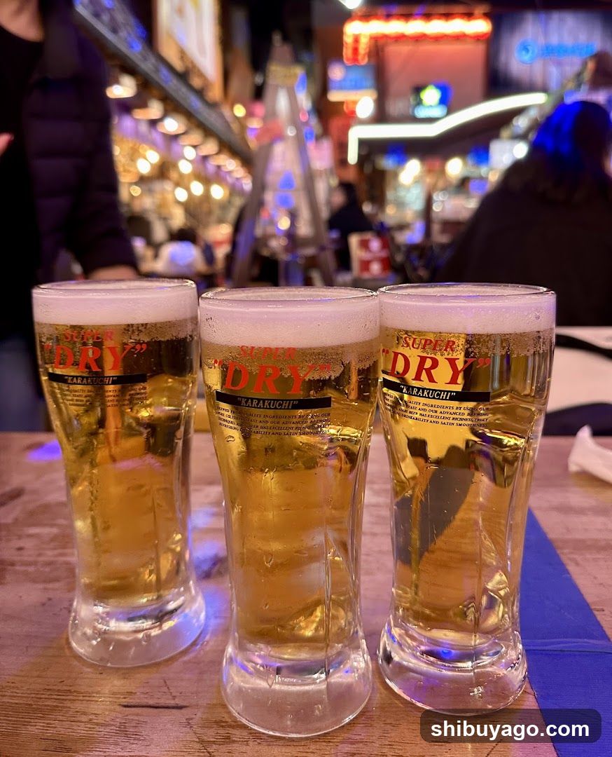 Three glasses of beer at a bar