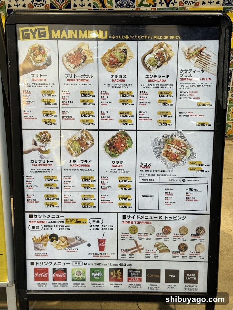 A vertical menu board displaying various food items with prices in yen, including Burrito, Nachos, Enchilada, and Taco options.