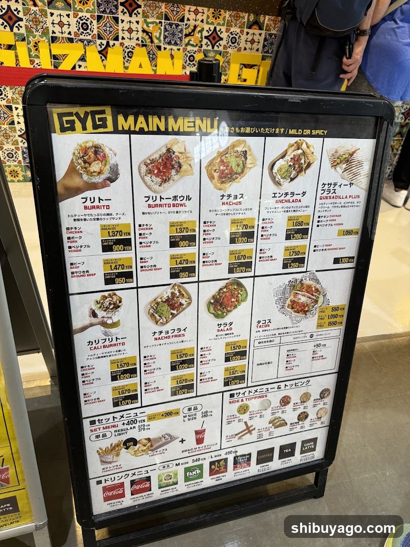 A framed menu board displaying various food items with prices in yen, including burritos, nachos, enchiladas, and tacos.