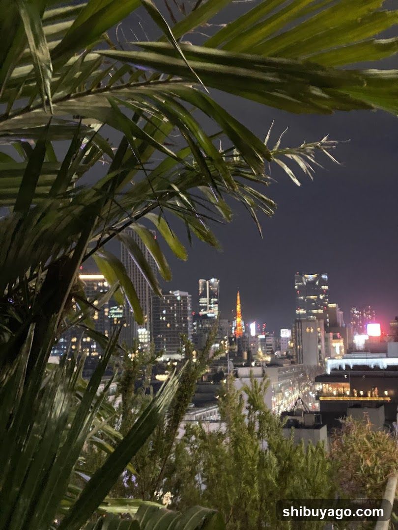 Night Cityscape with Palm Leaves