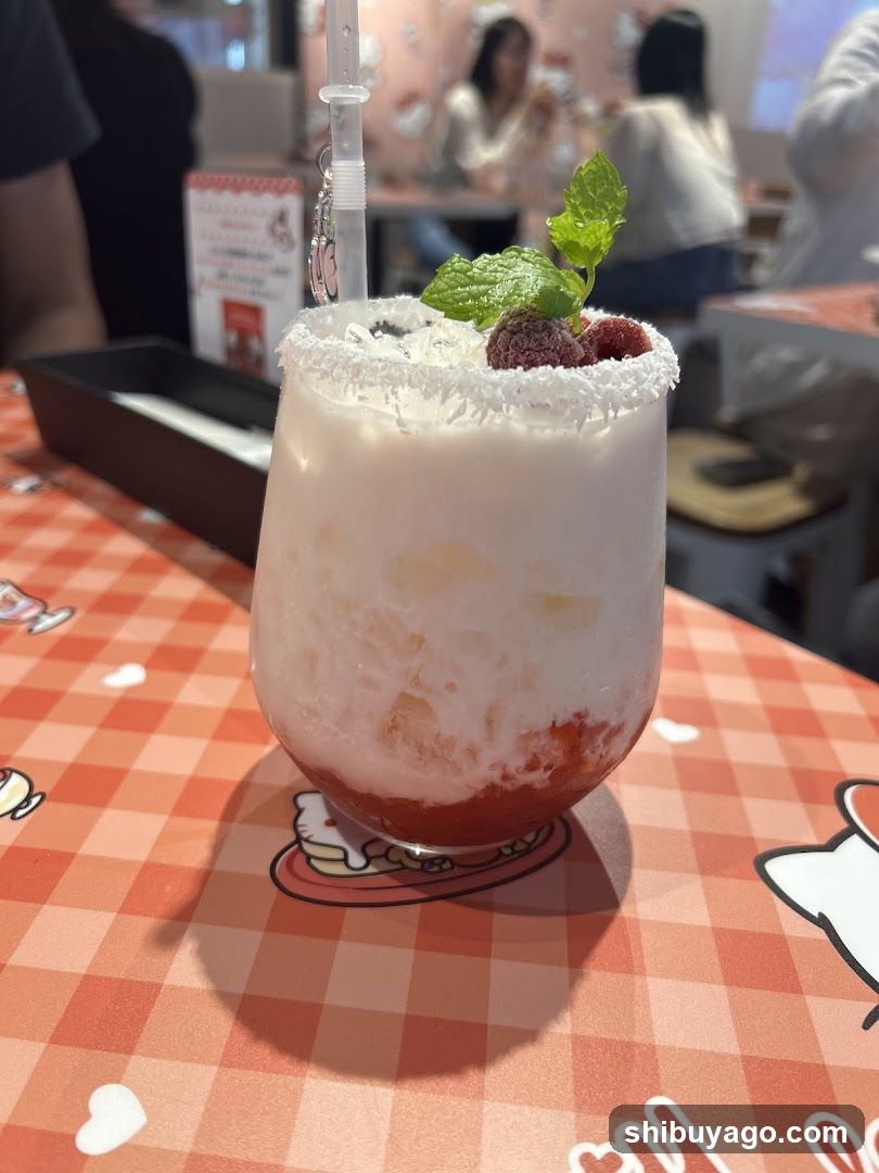 Raspberry Coconut Drink with Mint Garnish