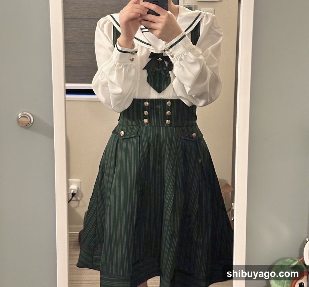 Mirror selfie of person in sailor-style outfit