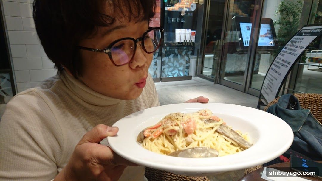 Person holding pasta dish