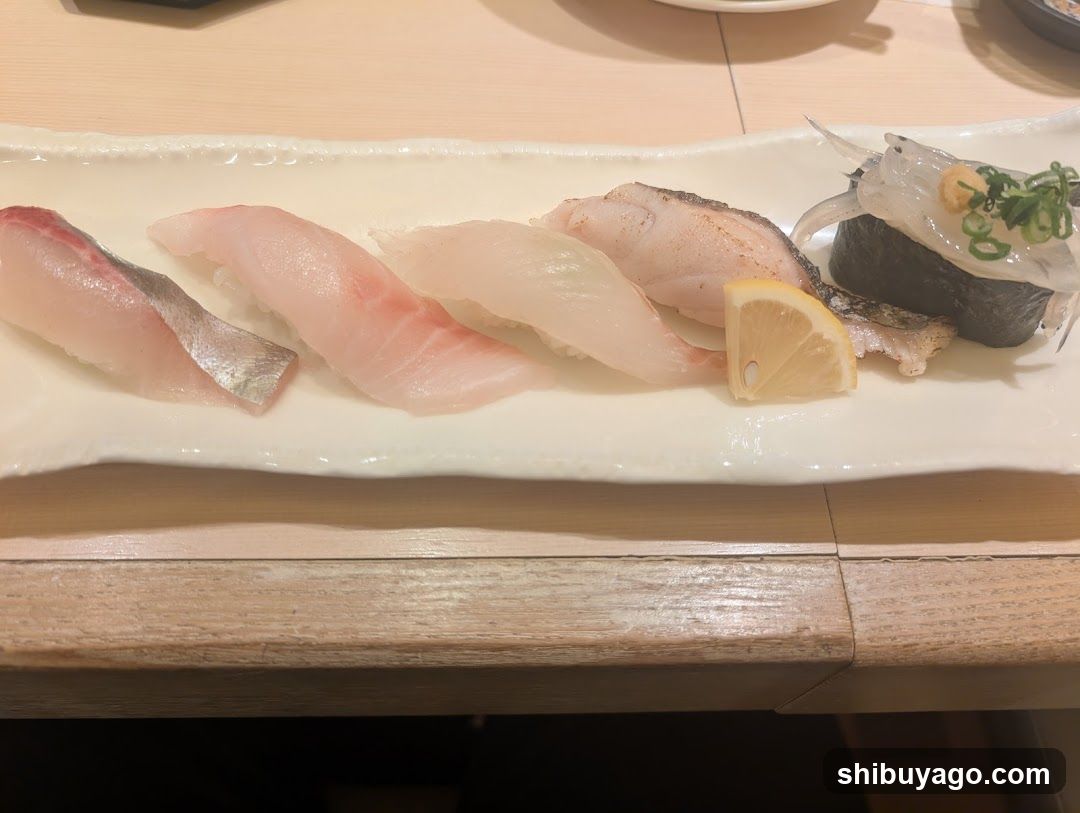 Sushi Platter with Fish Slices and Lemon Wedge