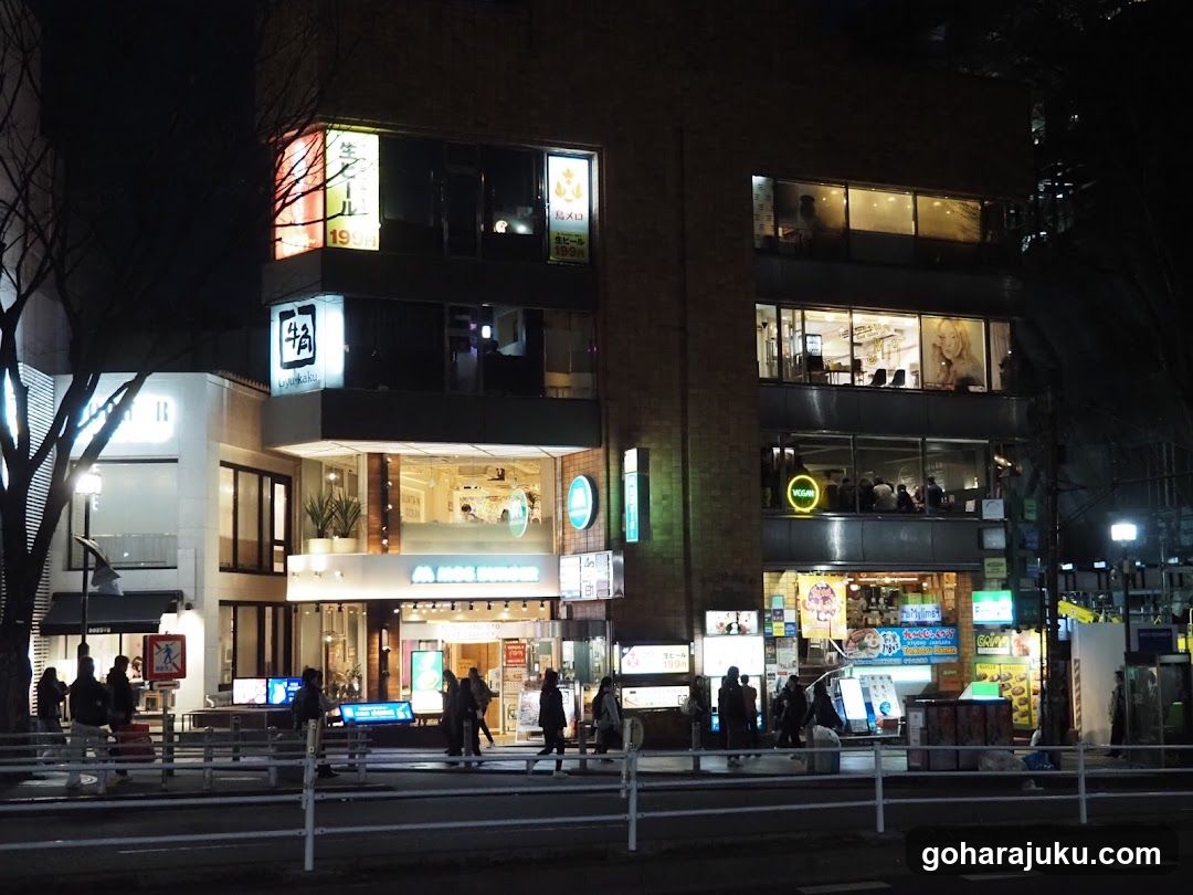 Night street scene with illuminated building