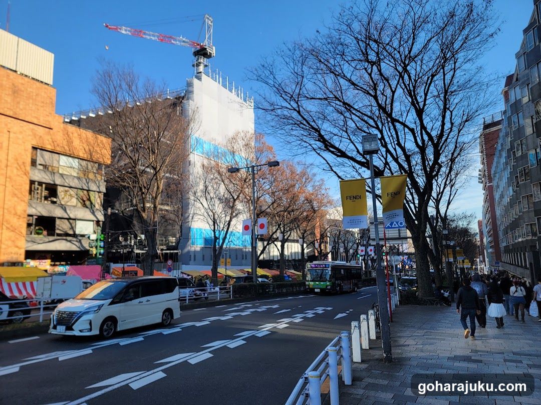 Urban street scene with construction and pedestrians
