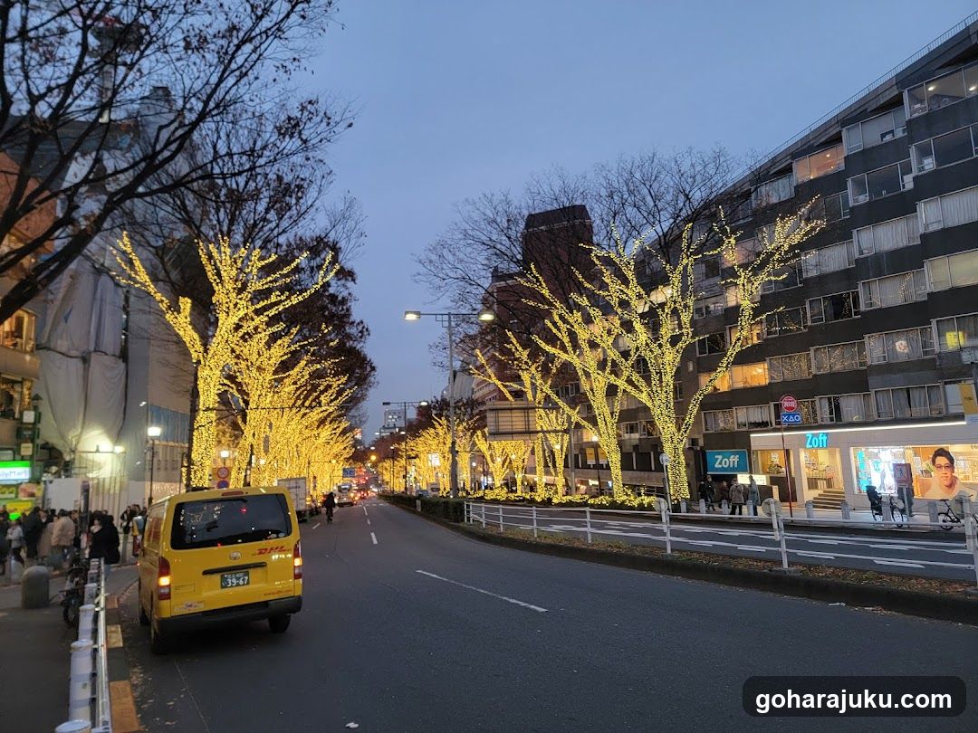 Street scene with illuminated trees and yellow van