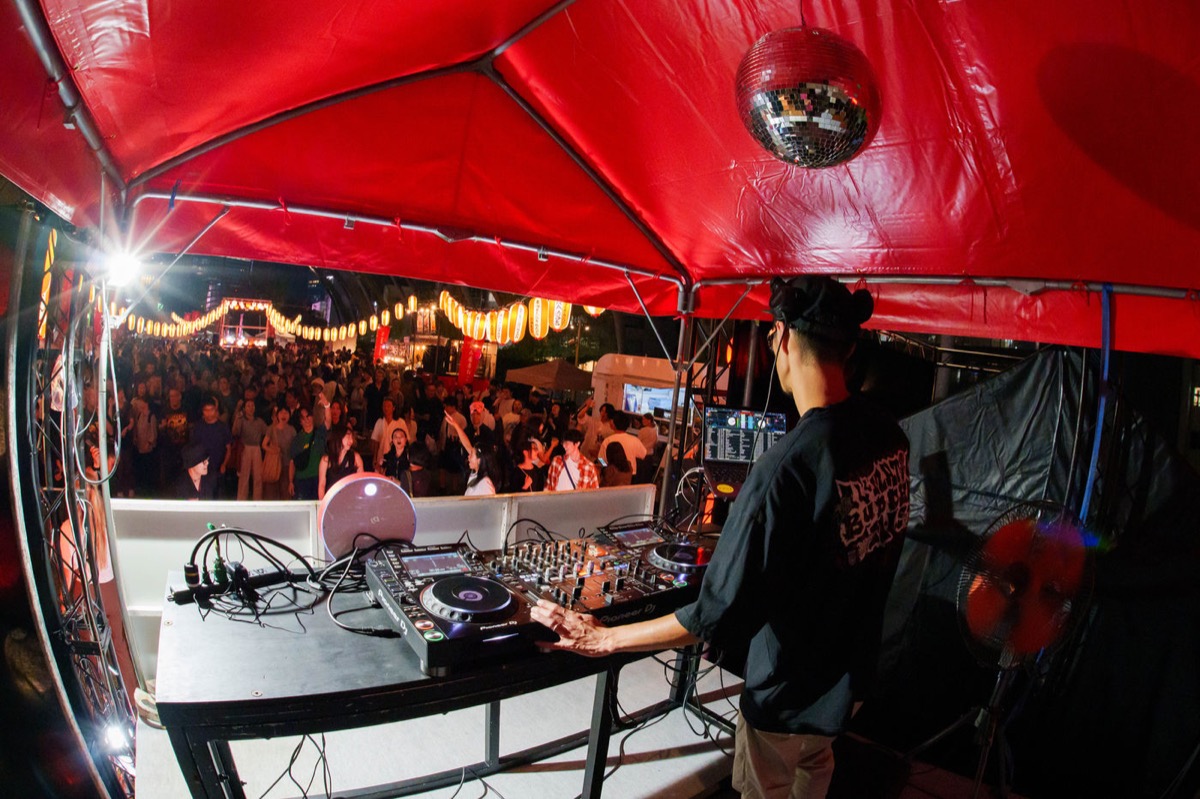 DJ booth and crowd at night during Miyashita Park BON DANCE