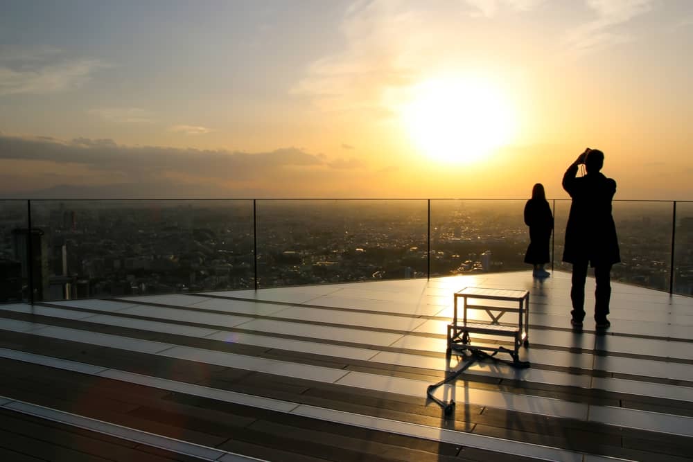 Sunset view from Shibuya Sky with Tokyo skyline glowing orange